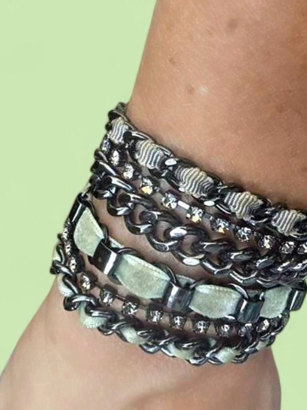 Juicy Couture Multi-layered silver chain bracelet with green bows 
6.5”